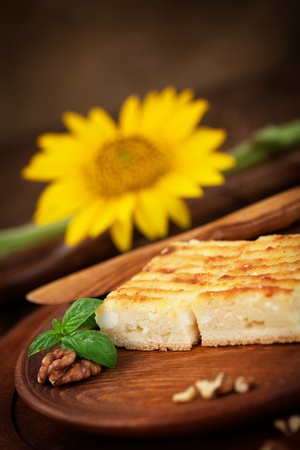 Cheese pie. Pastry cake with cheese on wooden background.の写真素材