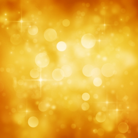 Gold Festive Christmas background  Elegant abstract background with bokeh defocused lights and starsの写真素材