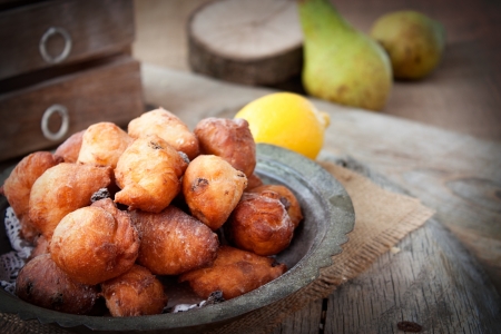 Bowl of Deep fried fritters donuts in rustic country settingの写真素材
