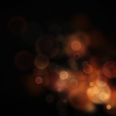 Gold Festive Christmas background. Elegant abstract background with bokeh defocused lights and starsの写真素材