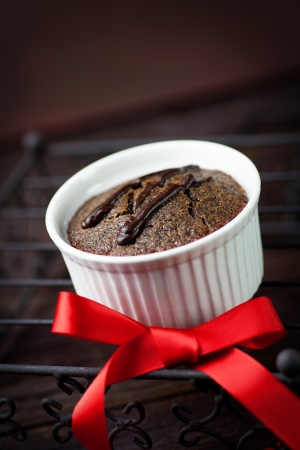 Chocolate cake  Souffle with red ribbon on wood の写真素材