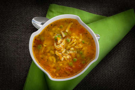 Vegetable soup. Stew with carrots, peas, pasta and parsleyの写真素材