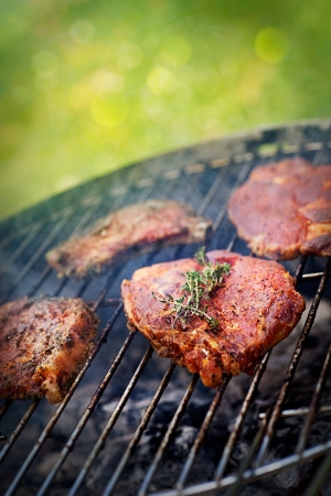 Grilled PorkSteak BBQ with herbs  Barbecue Meat Steak outdoor on fire grillの写真素材
