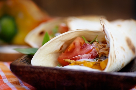 Mexican food  Fresh tortilla frajita wraps with chicken and vegetablesの写真素材