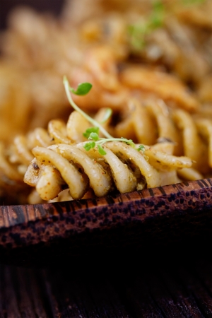 Italian cooking  Fusilli pasta with pesto basil sauce and chickenの写真素材