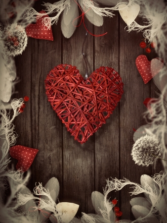Valentines ornaments on wood with hearts and ribbons.の写真素材