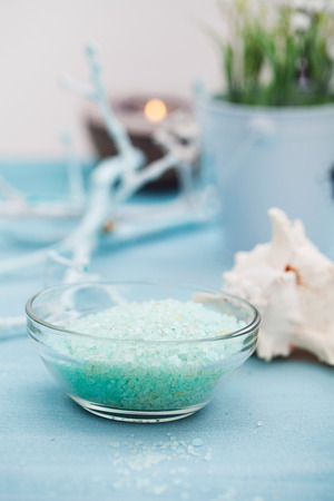 Spa and wellness setting with flowers, candles and towel. Blue dayspa nature set with copyspaceの写真素材