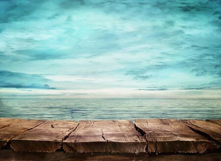 Wood table and tropical landscape in the background.. Spring or summer abstract nature background. Wood table and tropical landscape in the background.. Spring or summer abstract nature background.