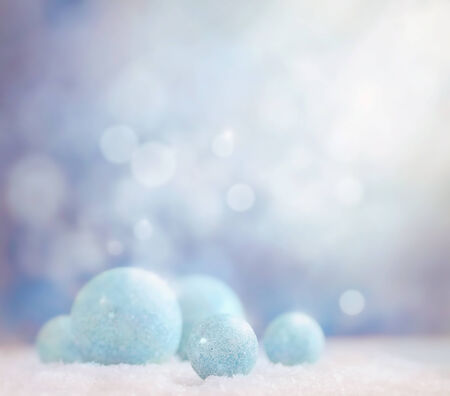 Xmas baubles on snow. Abstract backgroundの写真素材