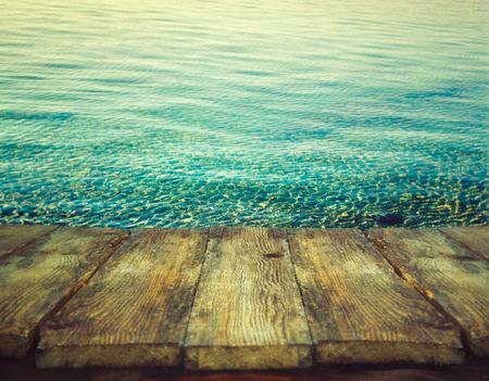 Wood table. Summer background. Ocean ripples. Holiday nature background.の写真素材