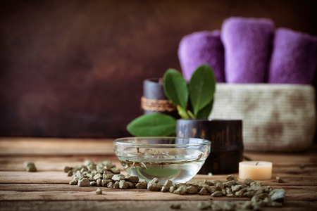 Spa and wellness setting with oils and plantsの写真素材