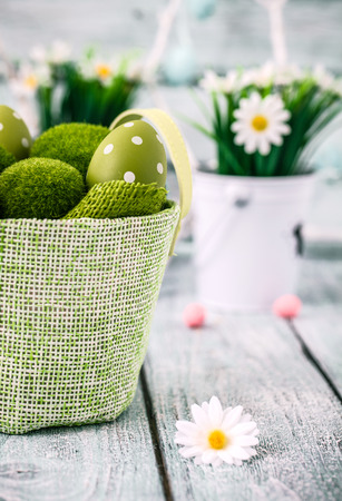 Easter. Painted Eggs on Easter table. Easter Egg in the Basket. Easter Decorationの写真素材
