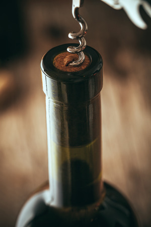 Wine. Glass of white wine in wine cellar. Old white wine on wood.の写真素材