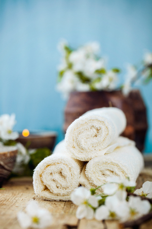 Spa and wellness setting with natural soap, candles and towel. Beige dayspa nature set with copyspaceの写真素材