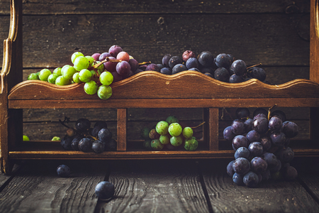Fresh grapes on wood. Autumn fruitの写真素材