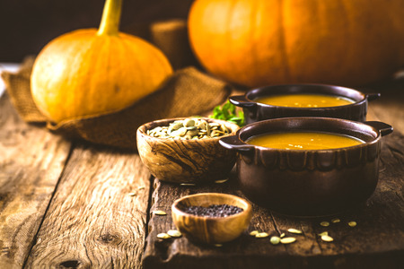 Pumpkin soup. Autumn dinner with healthy vegetable soupの写真素材
