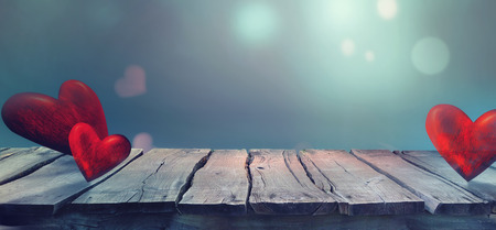 Valentines day. Valentines background with table and bokeh. Love red background. Valentines day empty displayの写真素材