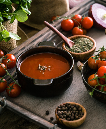 Tomato soup. Homemade tomato soup with tomatoes, herbs and spices. Comfort food.の写真素材