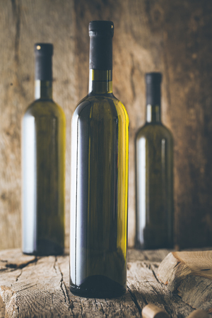 Wine. Glass of white wine in wine cellar. Old white wine on wood.の写真素材