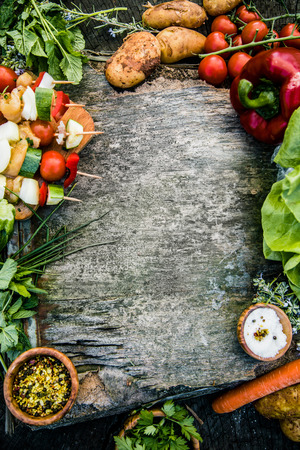 Healthy food ingredients background. Vegetables, herbs and spices. Organic vegetables on woodの写真素材