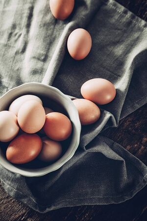 Organic eggs on woodの写真素材
