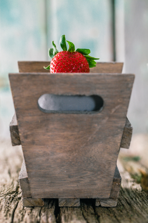 Fresh fruit. Strawberries on wood. Spring fruit.の写真素材