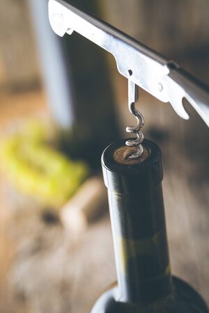 Wine. Glass of white wine in wine cellar. Old white wine on wood.の写真素材