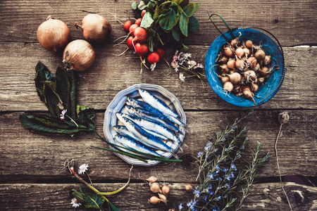 Fresh sardines. Fish with vegetables. Mediterranean fish on plateの写真素材