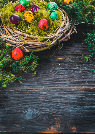Easter. Painted Eggs on Easter table. Easter Egg in the Basket. Easter Decorationの写真素材