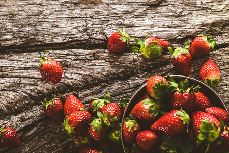 Fresh fruit. Strawberries on wood. Spring fruit.の写真素材