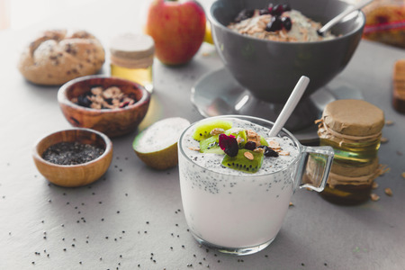 Healthy breakfast variety. Cereals with fruit. Yogurt with seedsの写真素材