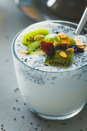 Healthy breakfast variety. Cereals with fruit. Yogurt with seedsの写真素材