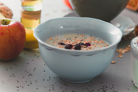 Healthy breakfast variety. Cereals with fruit. Yogurt with seedsの写真素材