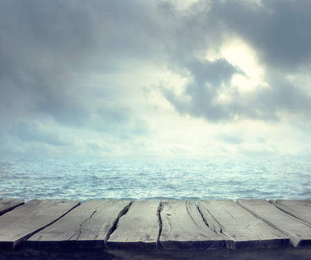 Sea summer abstract background. Golden sand beach with blue ocean and cloudscape and sunset in the back. Summer. Golden sandの写真素材