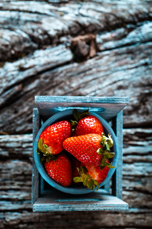 Fresh fruit. Strawberries on wood. Spring fruit.の写真素材