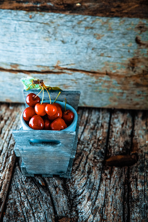 Fresh cherries on wood. Fresh organic fruit. Red cherriesの写真素材