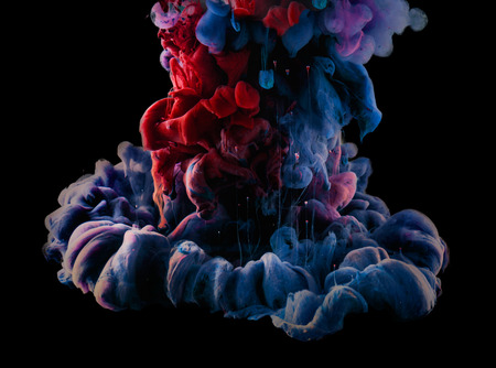 Ink in water. Abstract background. . Ink swirling in water.  Ink in water isolated on white background. Colorful ink in water.の写真素材