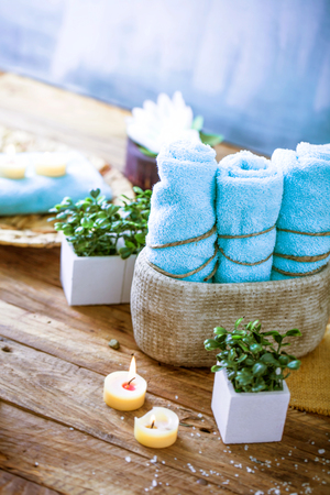 Spa and wellness setting with flowers and towels. Dayspa nature productsの写真素材