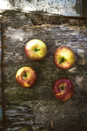 Organic fruit and vegetables.Apples on woodの写真素材