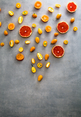 Orange fruit variety. Fruit assortment. Flat lay of fruit with drawn bottleの写真素材