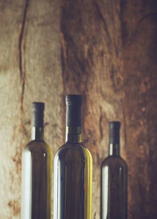 Wine. Glass of white wine in wine cellar. Old white wine on wood.の写真素材