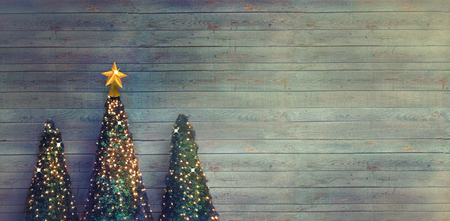 Christmas trees on wood. Christmas greeting card. Rustic Xmasの写真素材