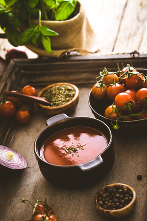 Tomato soup. Homemade tomato soup with tomatoes, herbs and spices. Comfort food.の写真素材