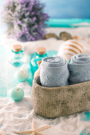 Spa and wellness setting with flowers and towels. Dayspa nature productsの写真素材