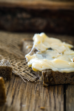 Cheese on wood. Types of cheese and herbs on woodの写真素材