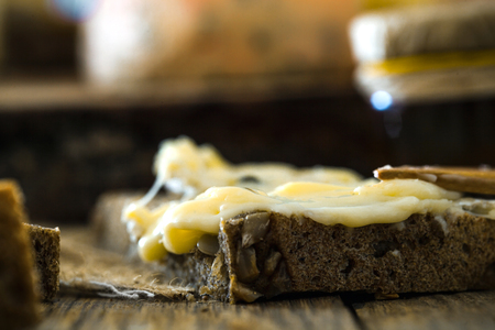 Cheese on wood. Types of cheese and herbs on woodの写真素材