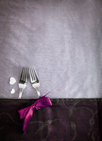 Valentines day table.Forks with purple ribbon. Gift for Valentine's day.St. Valentine tableの写真素材