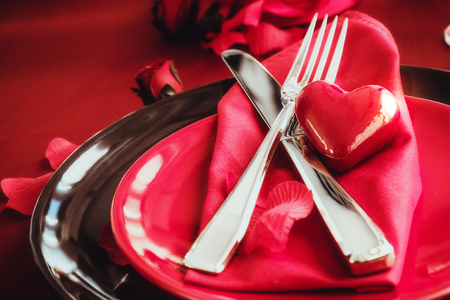 St. Vsalentines day dinner. Valentines daytable setting in rustic elegant style with cutlery. Romantic dinnerの写真素材