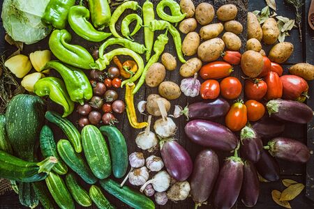 Vegetables on wood. Organic vegetables in rustic setting. Fresh food. Healthy veggiesの写真素材
