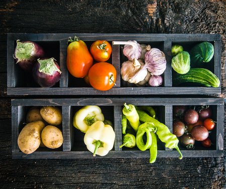 Vegetables on wood. Organic vegetables in rustic setting. Fresh food. Healthy veggiesの写真素材